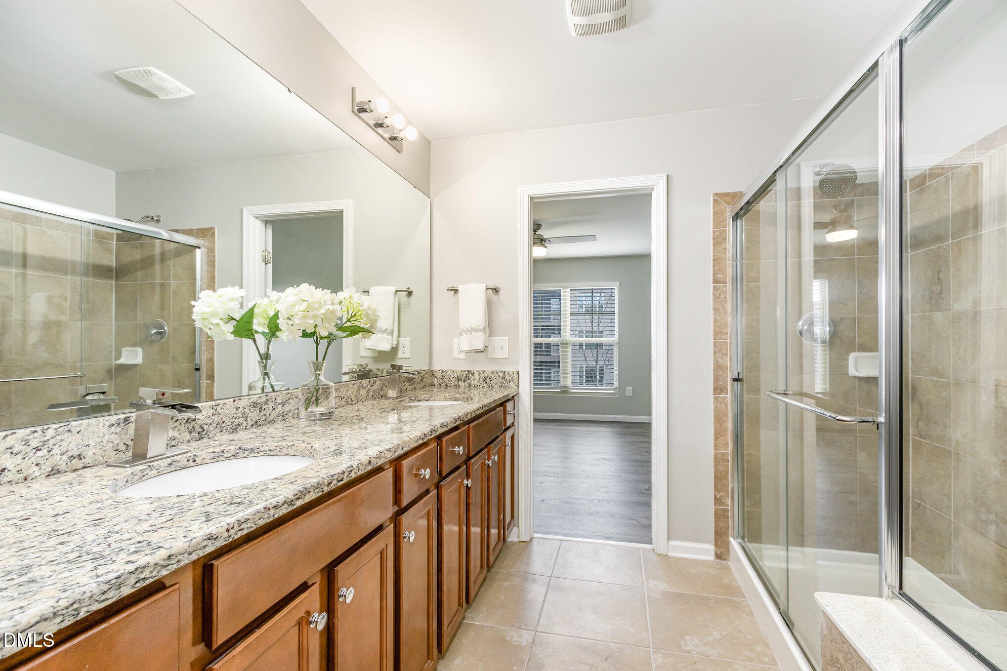 501 Brier Crossings Loop Durham, NC 27703 - Photo 19 of 31 a bathroom with a granite countertop sink and a mirror