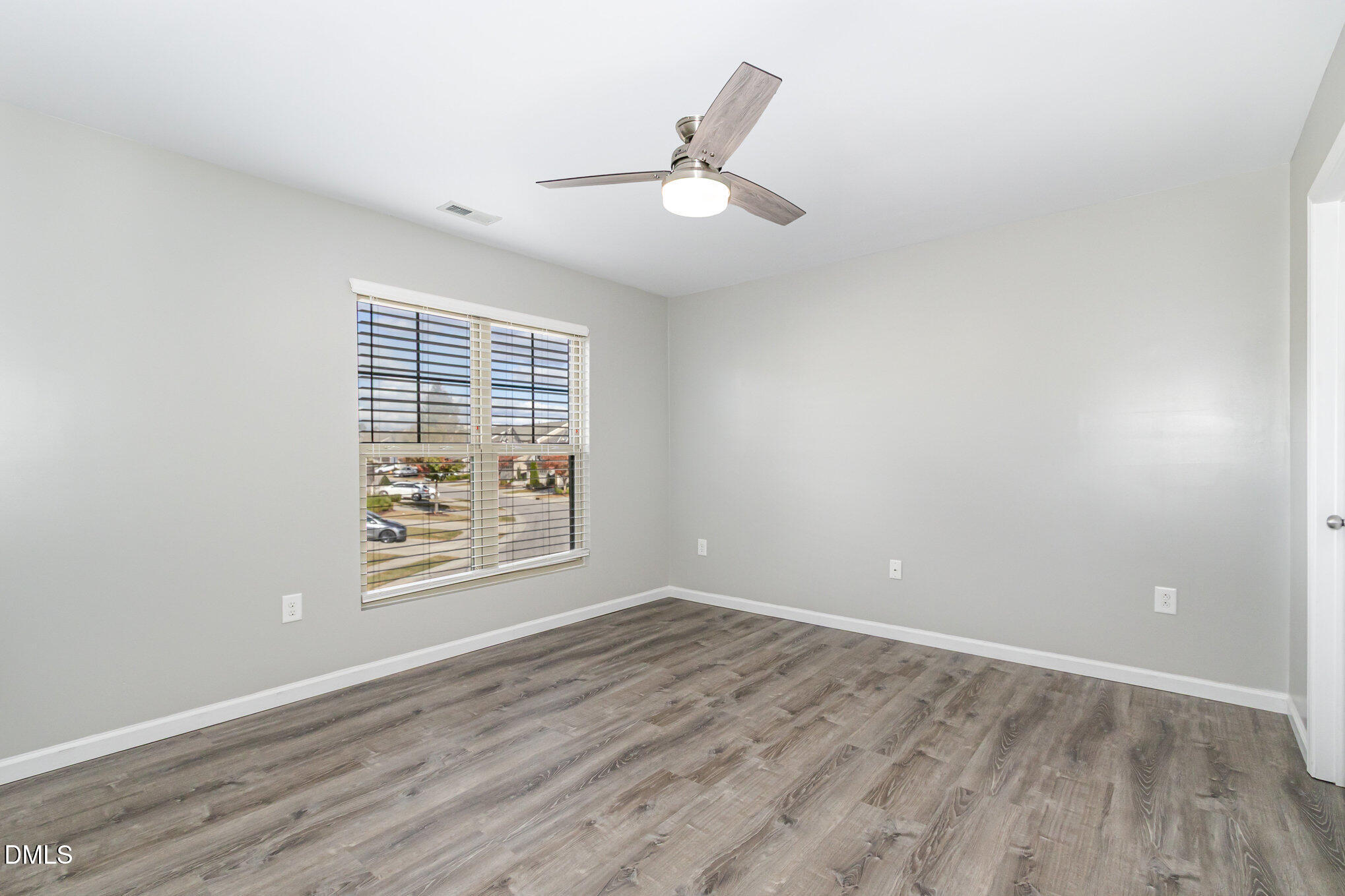 501 Brier Crossings Loop Durham, NC 27703 - Photo 21 of 31 wooden floor in an empty room with a window