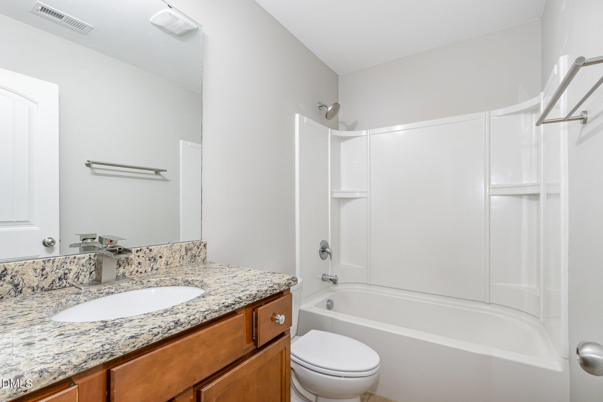 501 Brier Crossings Loop Durham, NC 27703 - Photo 23 of 31 a bathroom with a granite countertop sink a toilet and shower