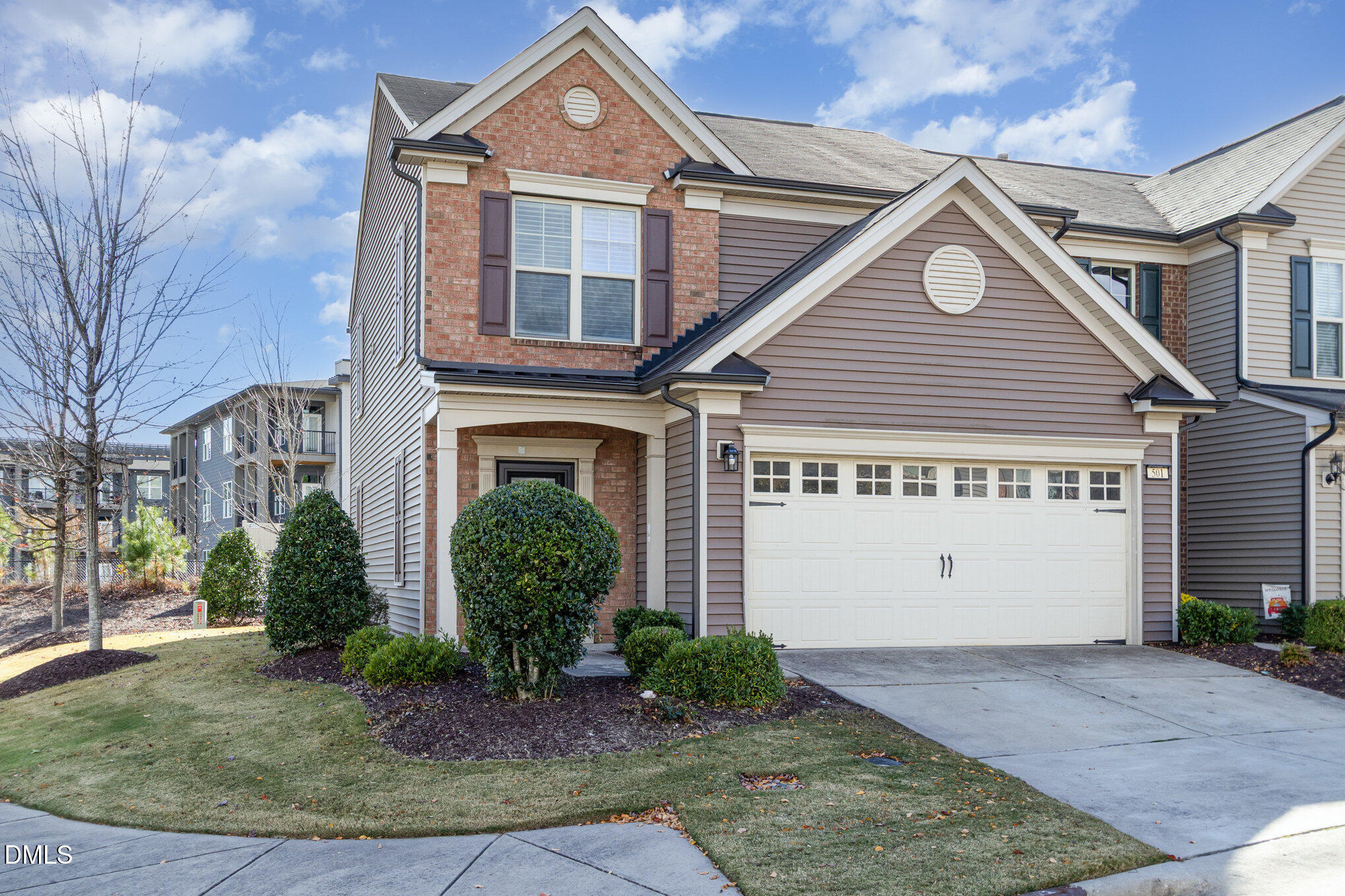 501 Brier Crossings Loop Durham, NC 27703 - Photo 2 of 31 a front view of a house with garden