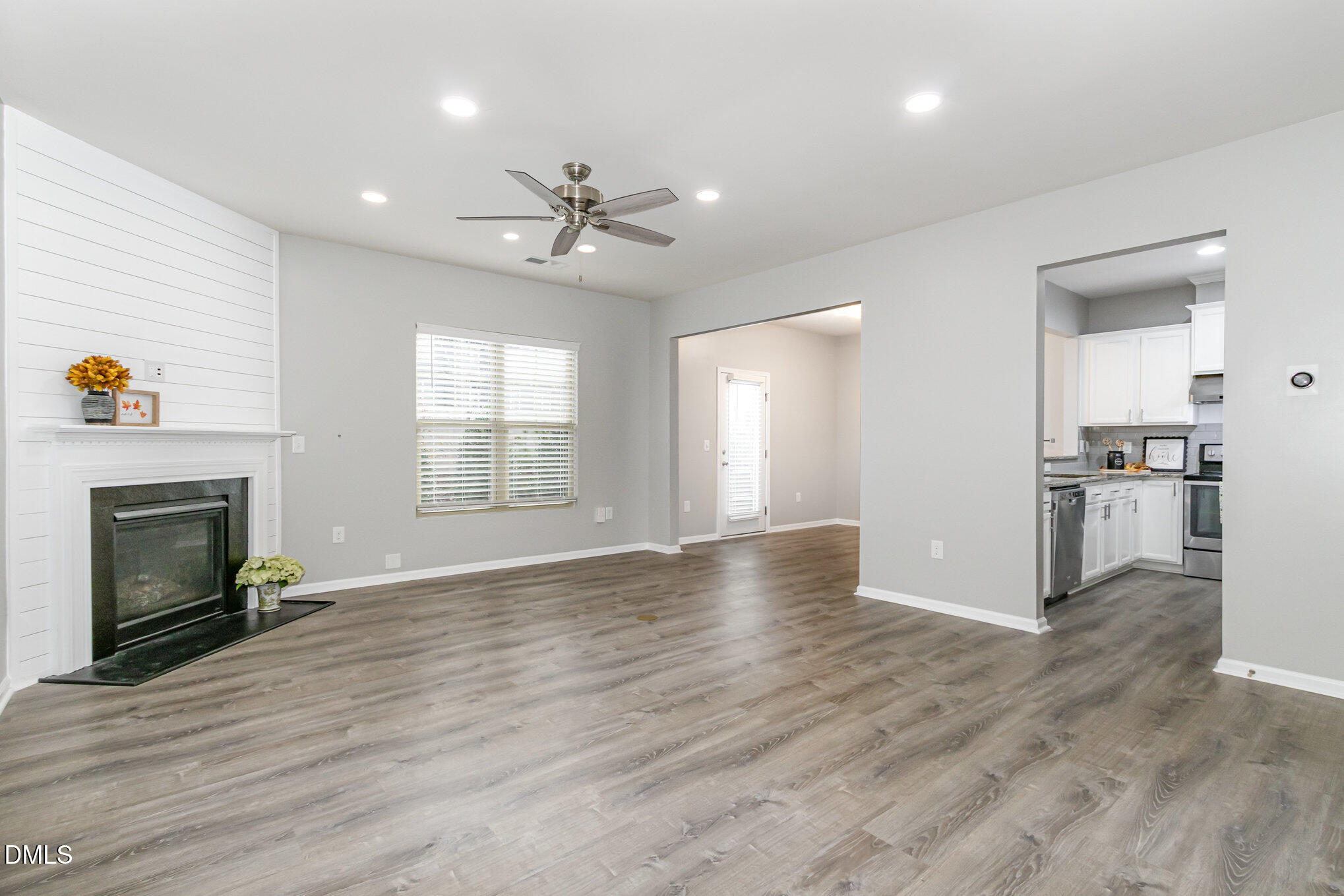 501 Brier Crossings Loop Durham, NC 27703 - Photo 5 of 31 a view of empty room with wooden floor and fireplace