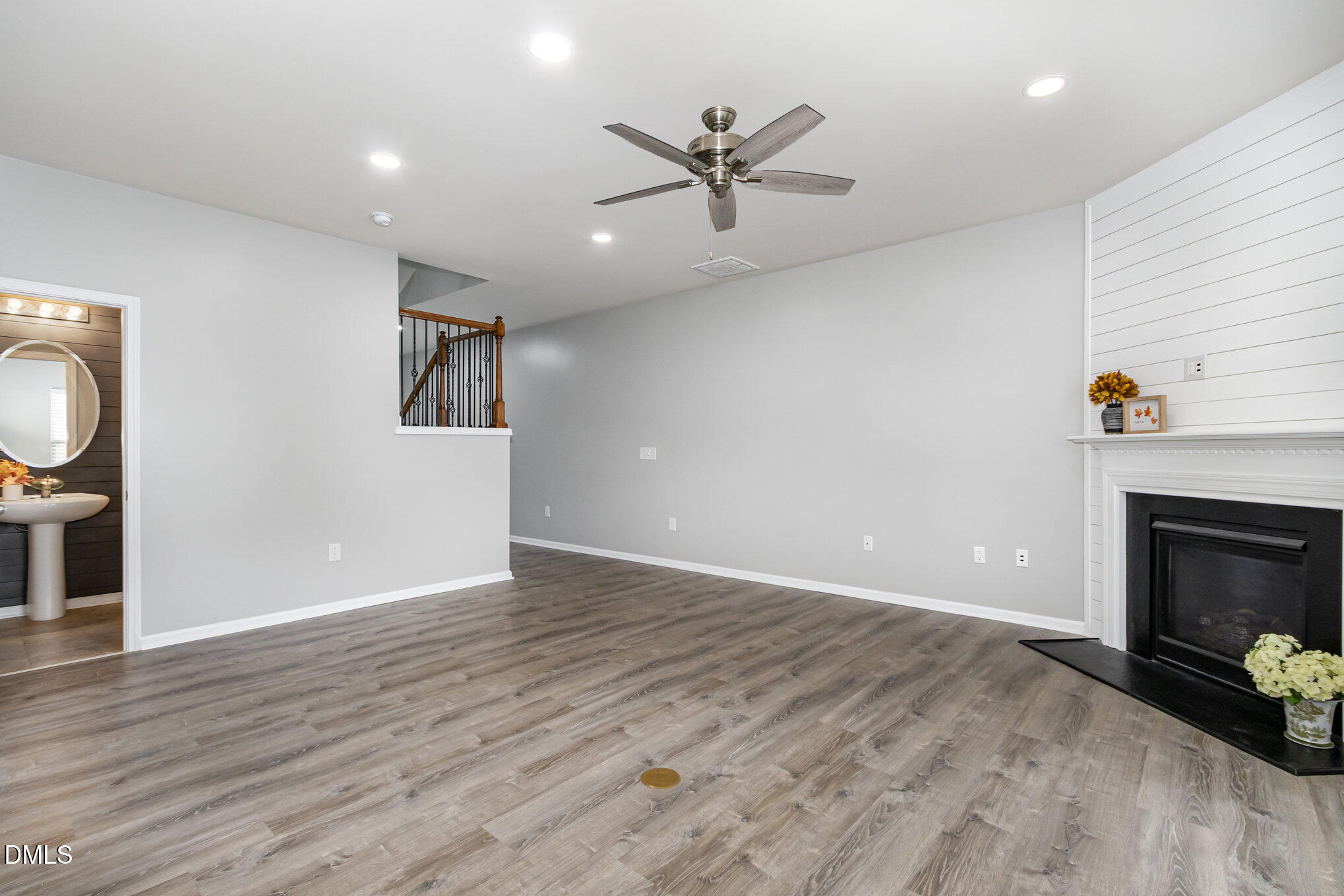 501 Brier Crossings Loop Durham, NC 27703 - Photo 8 of 31 an empty room with wooden floor fireplace and windows