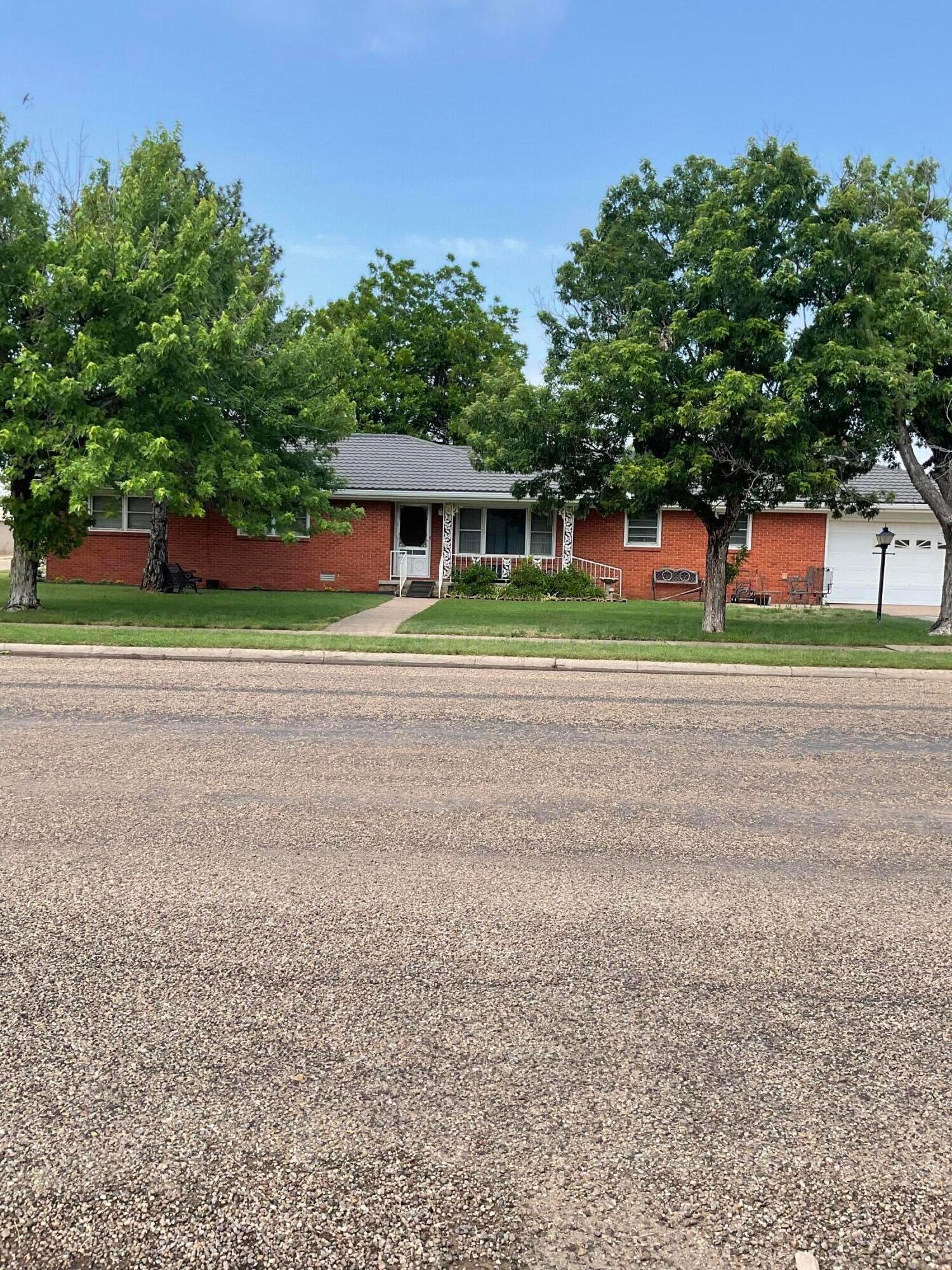 1401 Maple Avenue Panhandle, TX 79068 - Photo 1 of 42 a small white house in a big yard with large trees