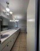 1401 Maple Avenue Panhandle, TX 79068 - Photo 15 of 42 a bathroom with a mirror and a shower