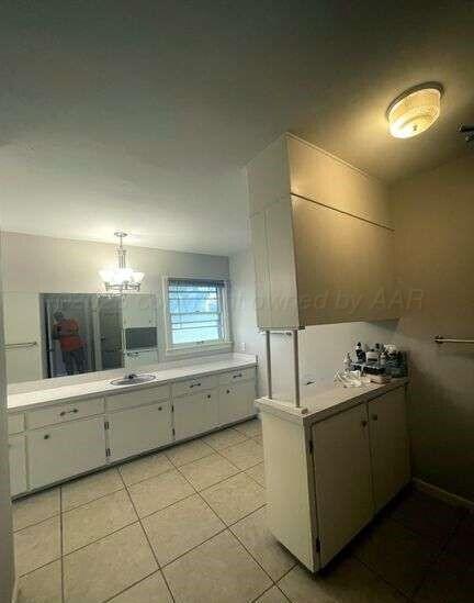 1401 Maple Avenue Panhandle, TX 79068 - Photo 19 of 42 a view of a kitchen with a sink and dishwasher a stove with wooden floor