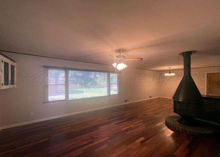 1401 Maple Avenue Panhandle, TX 79068 - Photo 21 of 42 a view of empty room with wooden floor and fan