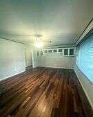 1401 Maple Avenue Panhandle, TX 79068 - Photo 22 of 42 a view of empty room with wooden floor