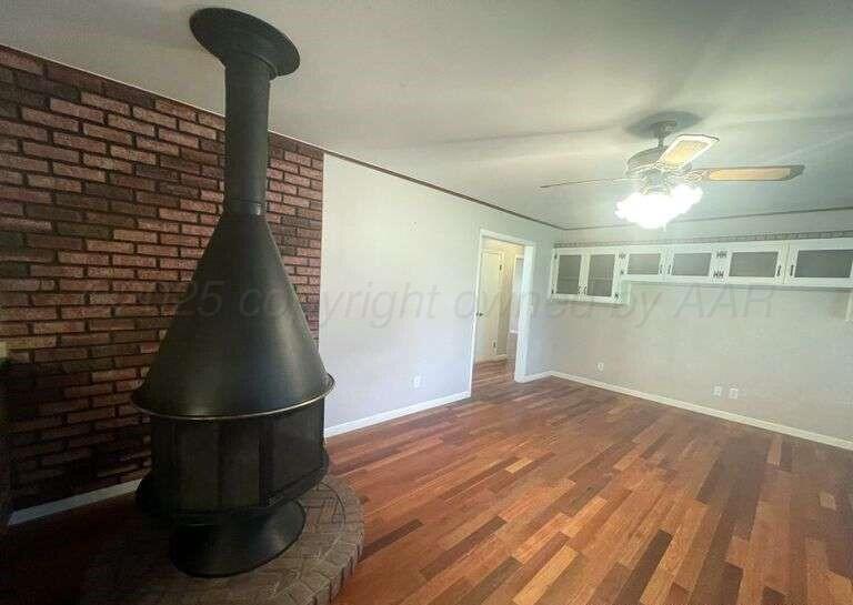 1401 Maple Avenue Panhandle, TX 79068 - Photo 24 of 42 a view of empty room with wooden floor and fan