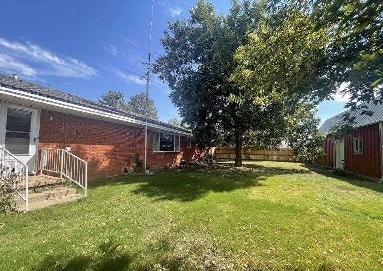1401 Maple Avenue Panhandle, TX 79068 - Photo 37 of 42 a view of a backyard with a large tree