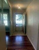1401 Maple Avenue Panhandle, TX 79068 - Photo 7 of 42 an empty room with wooden floor and windows