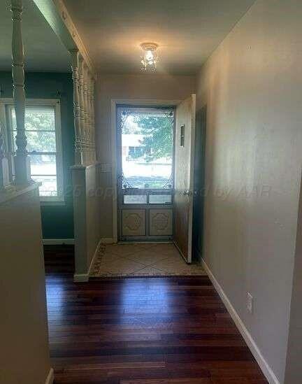 1401 Maple Avenue Panhandle, TX 79068 - Photo 8 of 42 a view of empty room with wooden floor and fan