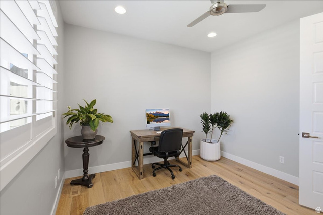 21 Pier Place Tooele, UT 84074 - Photo 41 of 112 Bright room featuring wood-finish flooring, white plantation shutters, a modern ceiling fan, recessed lighting, and a five-panel interior door