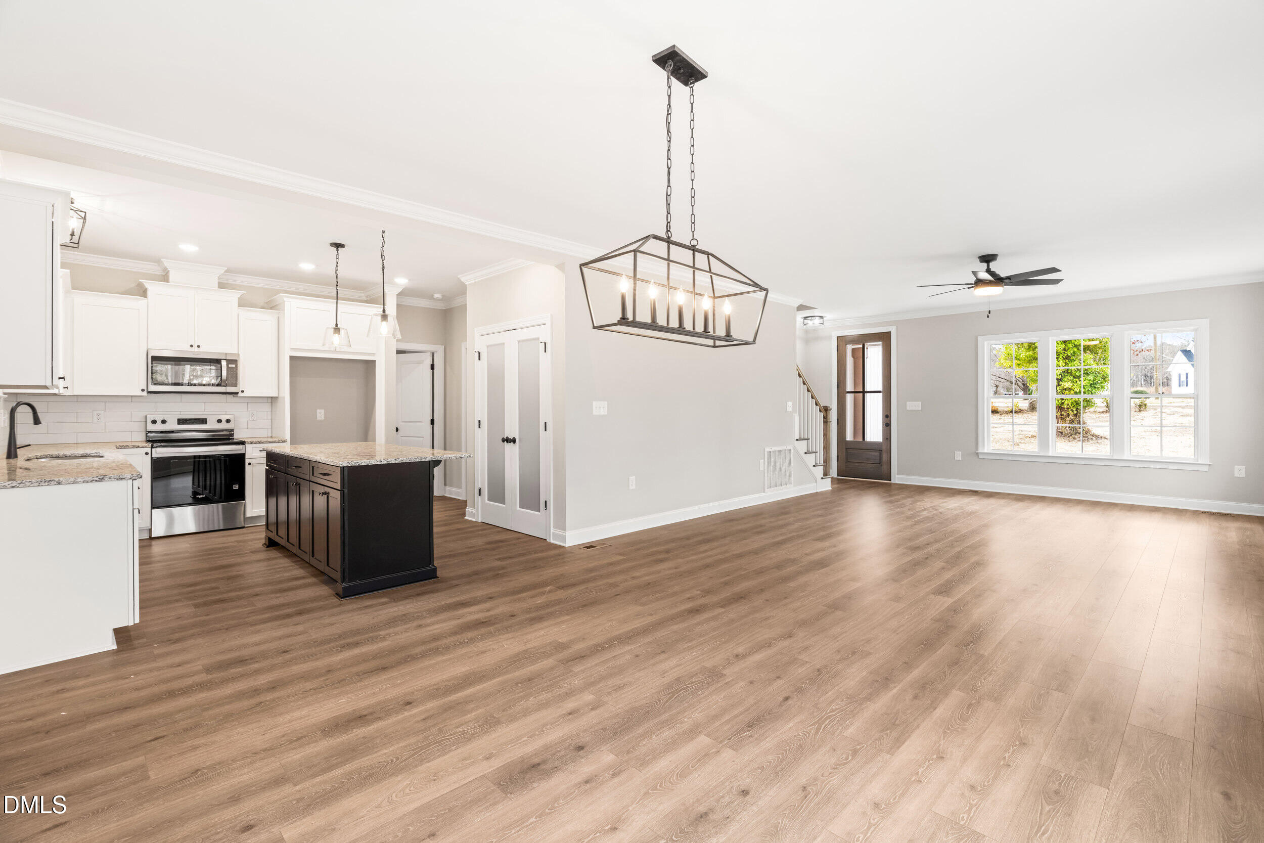 4029 Lake Wendell Road Wendell, NC 27591 - Photo 15 of 44 a view of wooden floor and windows in a room
