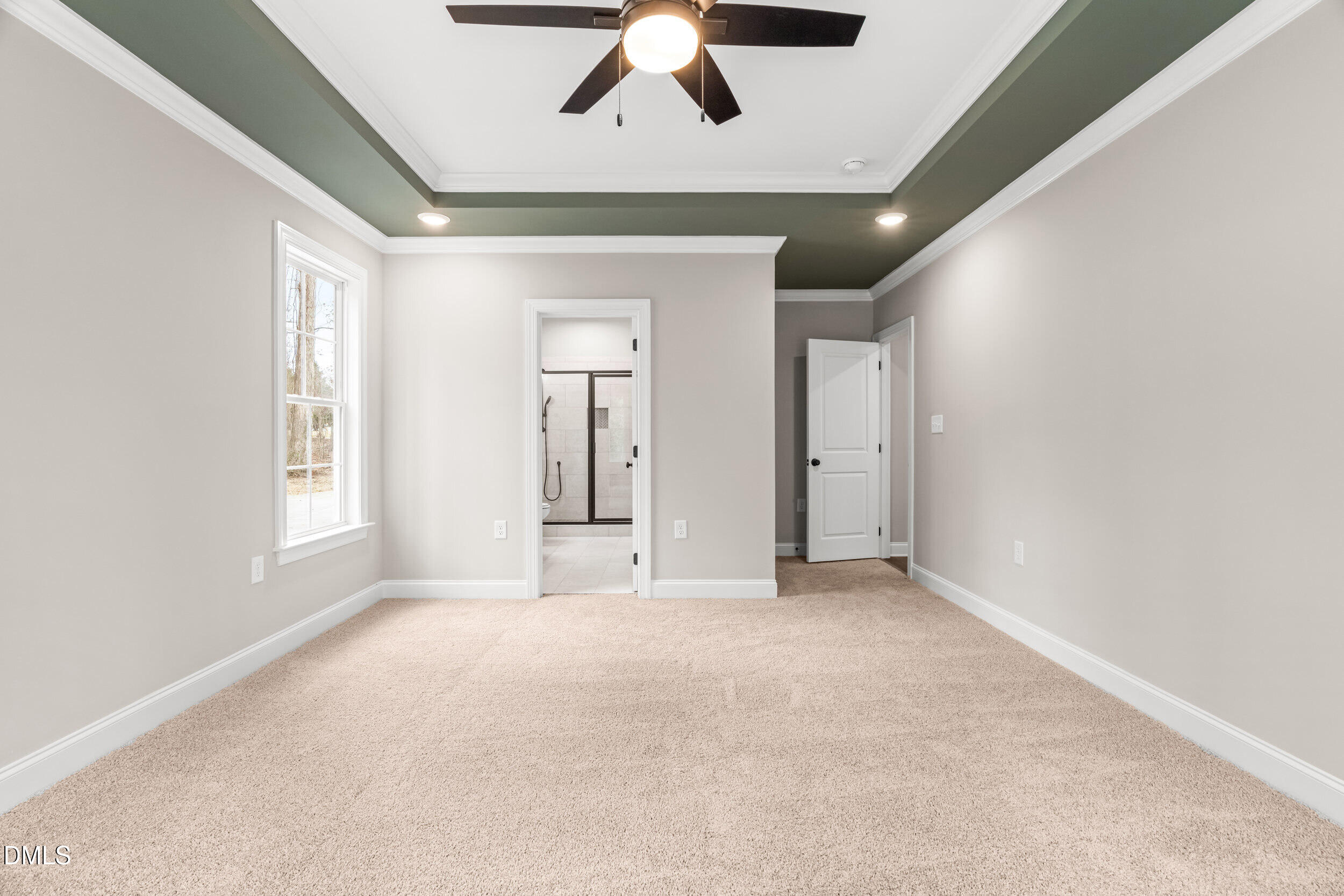 4029 Lake Wendell Road Wendell, NC 27591 - Photo 23 of 44 an empty room with chandelier fan and windows