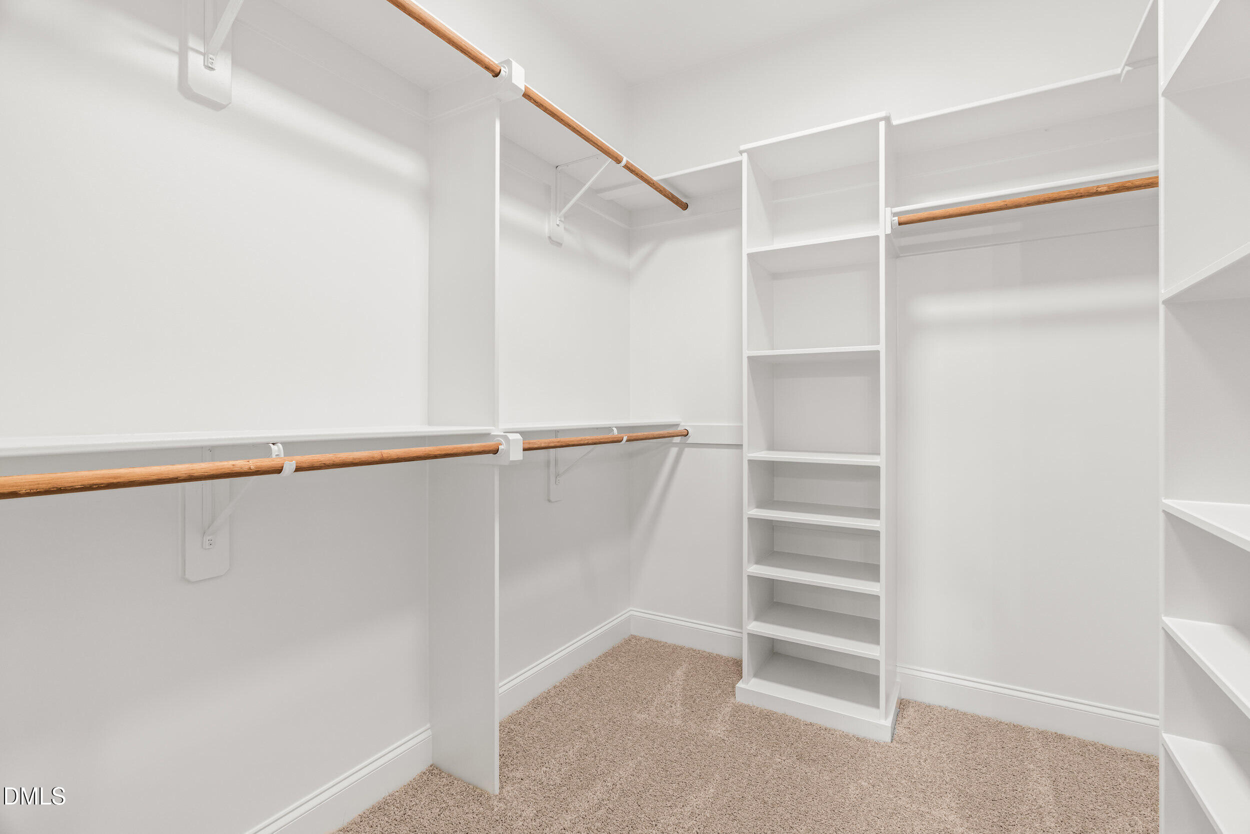 4029 Lake Wendell Road Wendell, NC 27591 - Photo 25 of 44 a view of walk in closet with empty racks