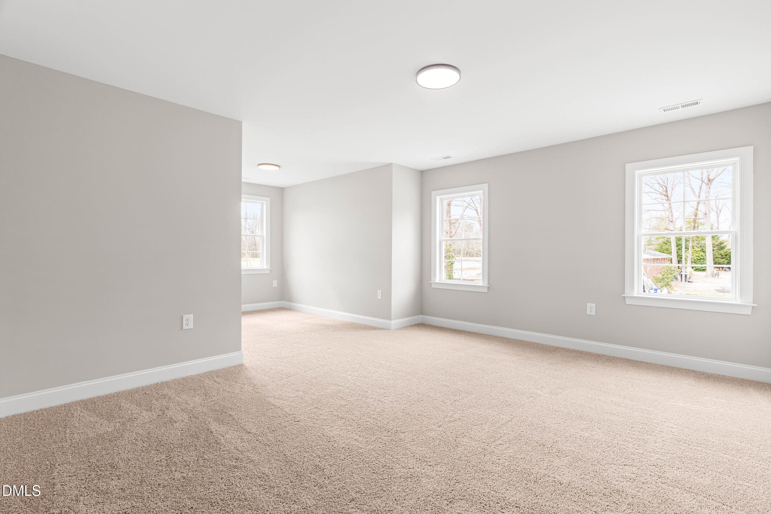 4029 Lake Wendell Road Wendell, NC 27591 - Photo 26 of 44 an empty room with windows and closet