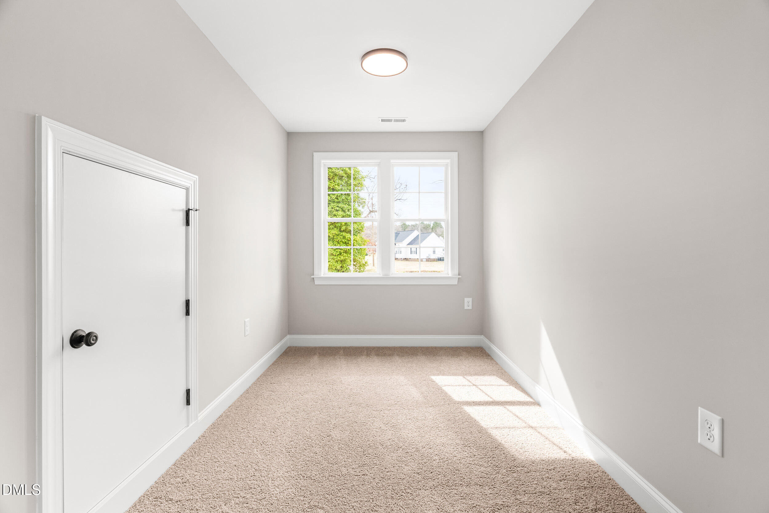 4029 Lake Wendell Road Wendell, NC 27591 - Photo 28 of 44 an empty room with windows
