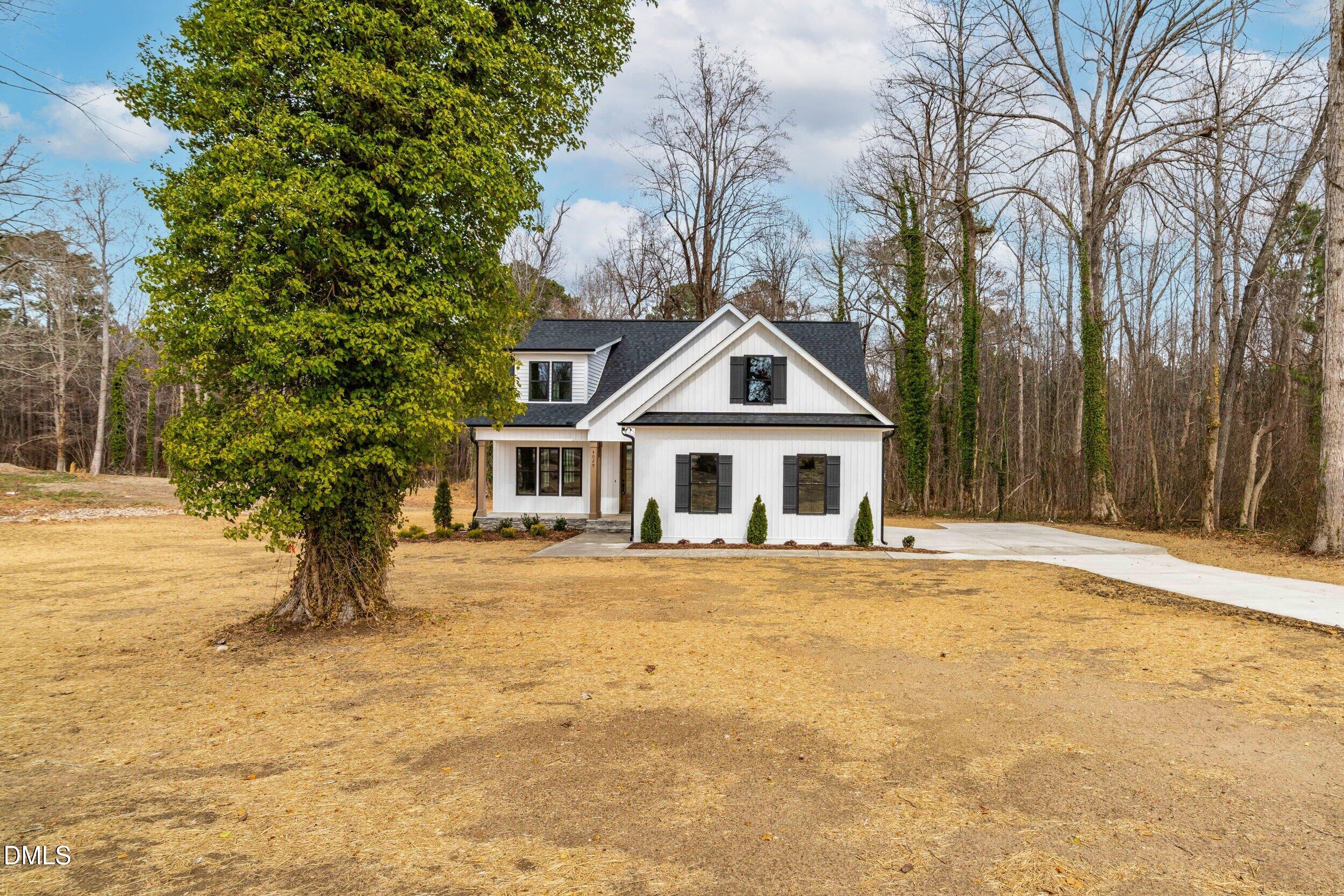 4029 Lake Wendell Road Wendell, NC 27591 - Photo 2 of 44 a front view of a house with a yard