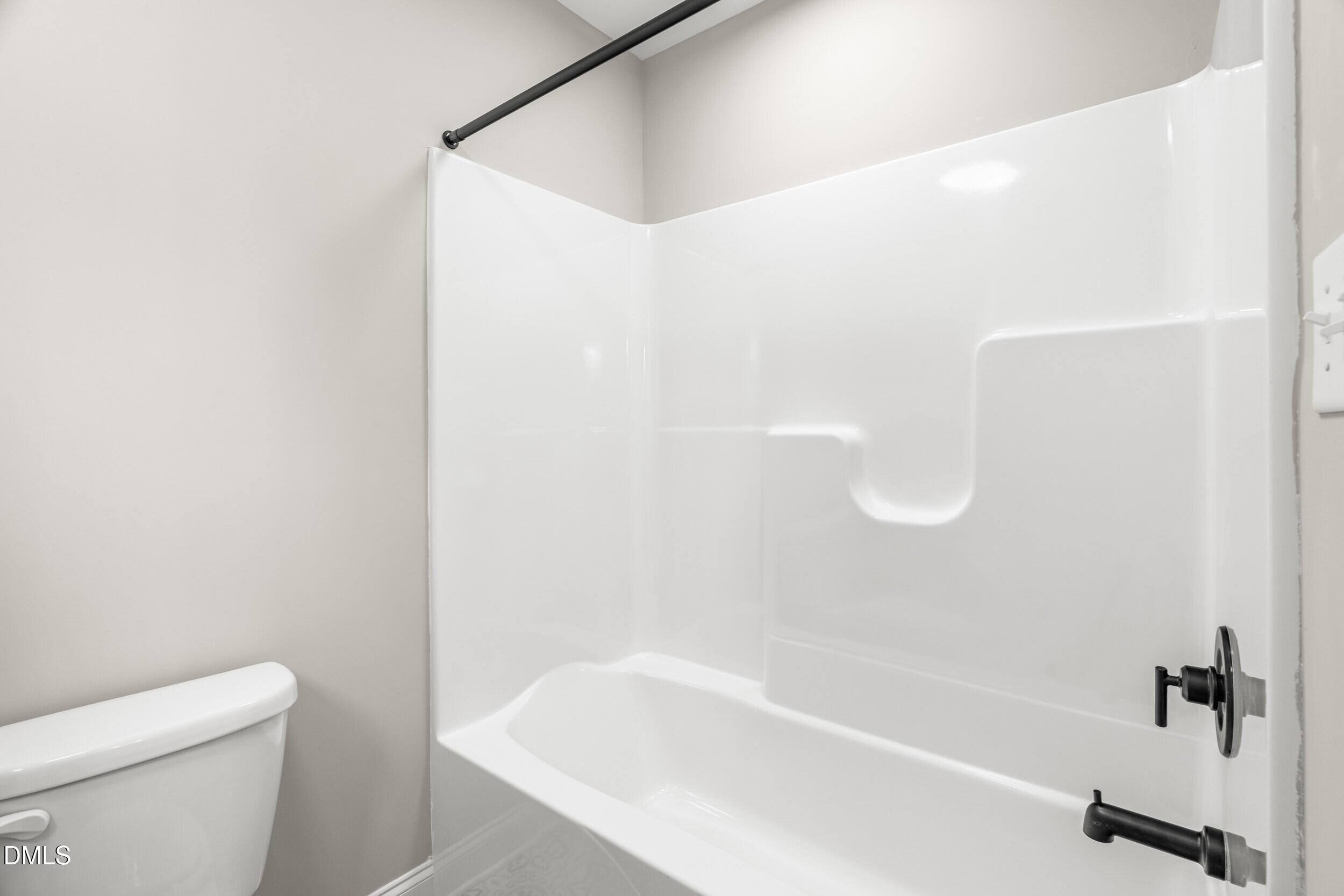 4029 Lake Wendell Road Wendell, NC 27591 - Photo 37 of 44 a bathroom with a bathtub and a toilet