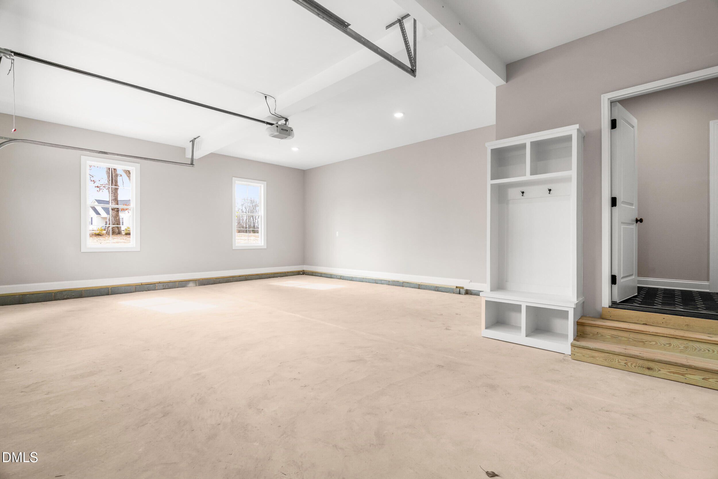 4029 Lake Wendell Road Wendell, NC 27591 - Photo 38 of 44 an empty room with windows and pillars in it