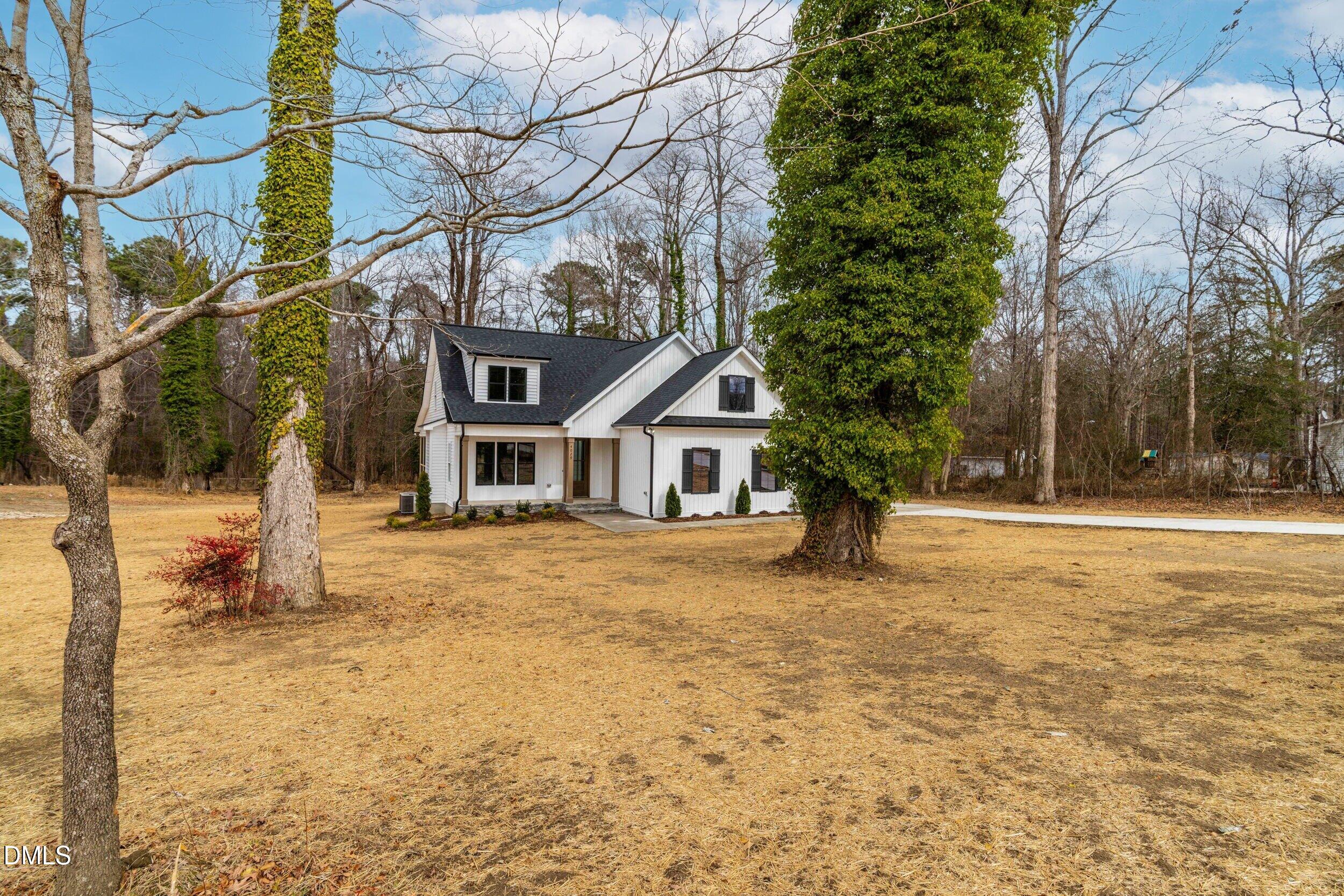 4029 Lake Wendell Road Wendell, NC 27591 - Photo 3 of 44 a house that has a tree in front of it