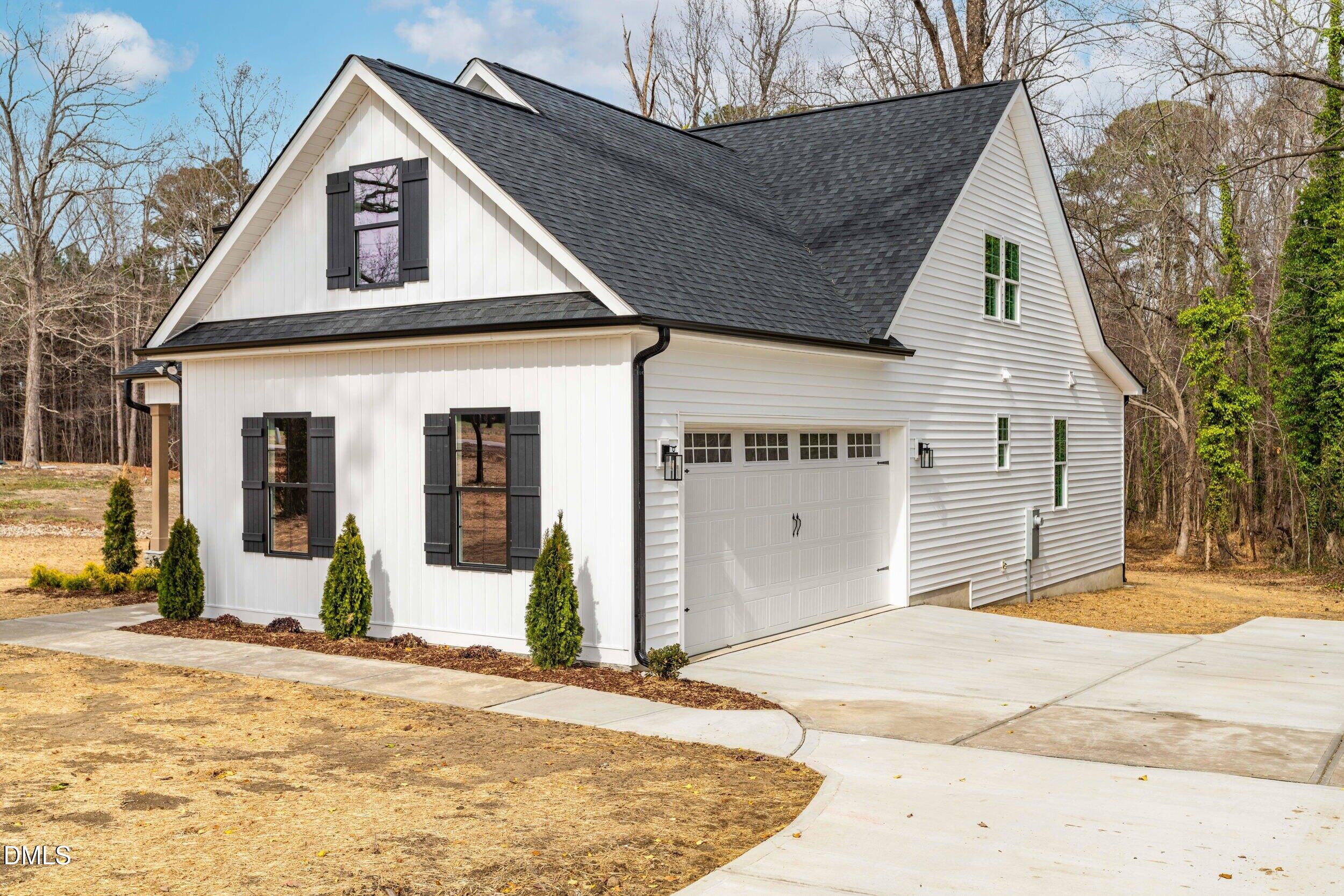 4029 Lake Wendell Road Wendell, NC 27591 - Photo 41 of 44 a view of a house with snow on the side of the road