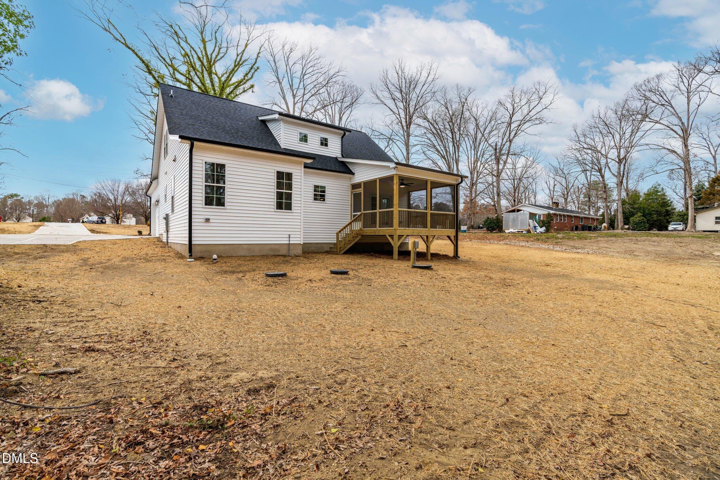 4029 Lake Wendell Road Wendell, NC 27591 - Photo 8 of 44 a view of a house with a snow in the yard