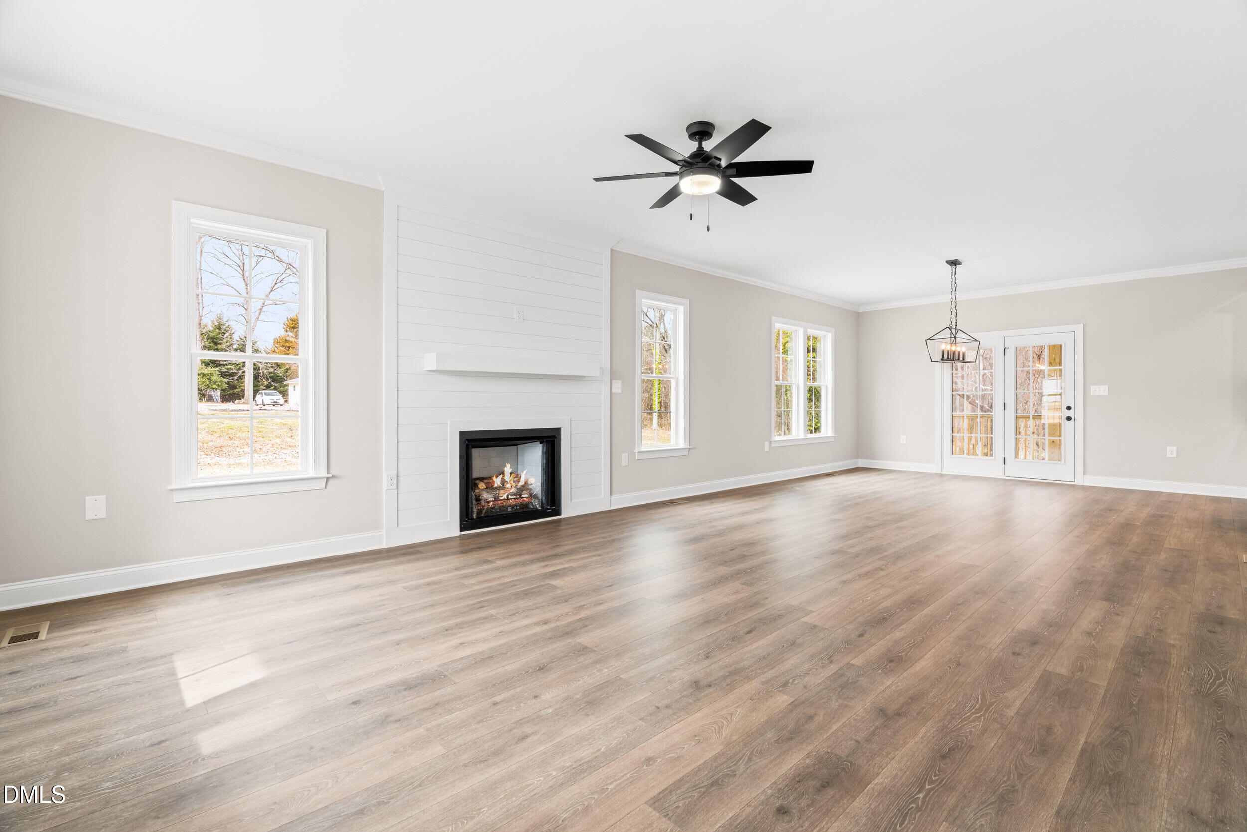 4029 Lake Wendell Road Wendell, NC 27591 - Photo 9 of 44 a view of an empty room with wooden floor and a window