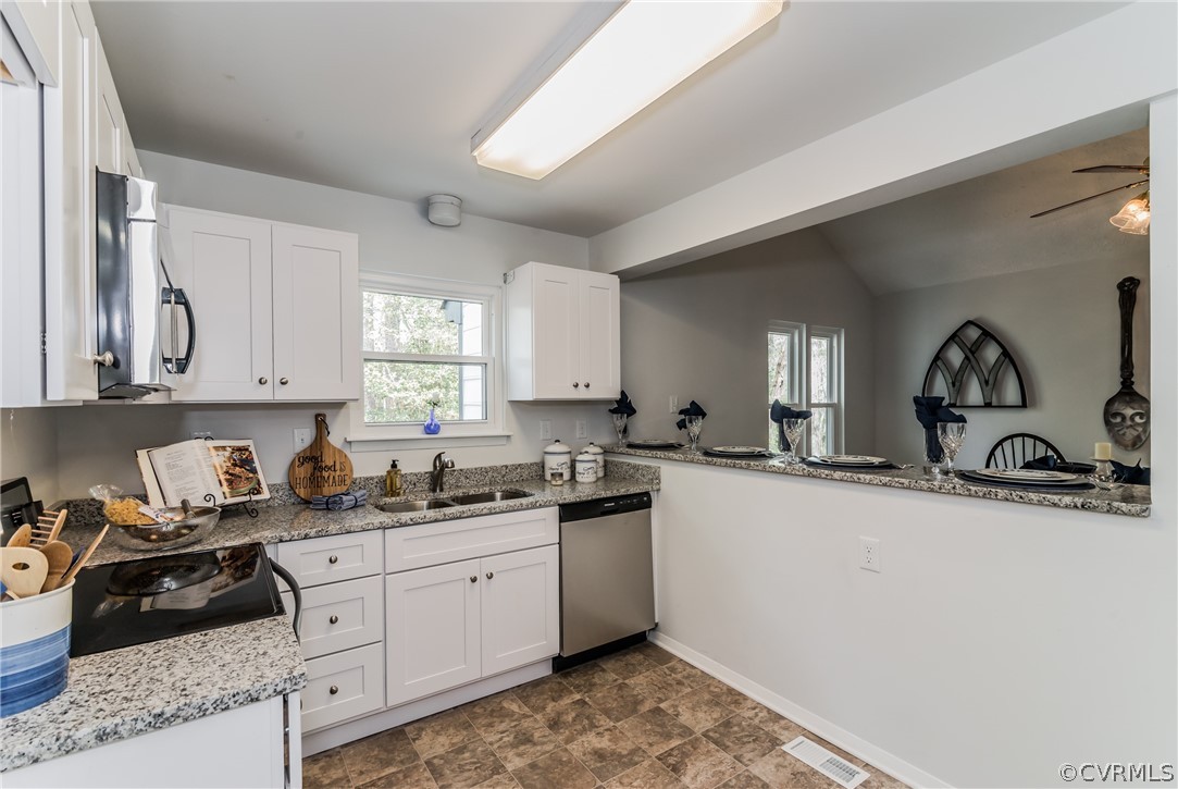 4403 Rabbit Foot Place North Chesterfield, VA 23236 - Photo 21 of 50 a kitchen with a sink stove and cabinets
