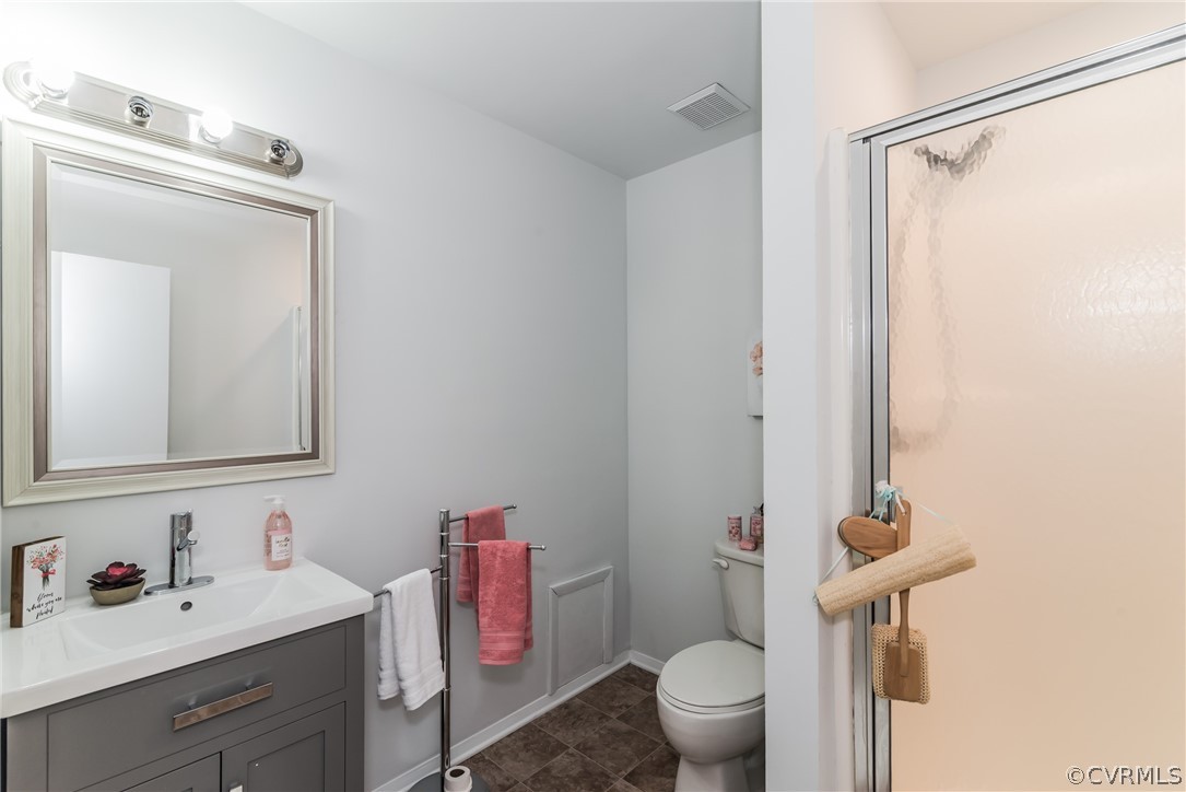 4403 Rabbit Foot Place North Chesterfield, VA 23236 - Photo 29 of 50 a bathroom with a sink vanity mirror and toilet
