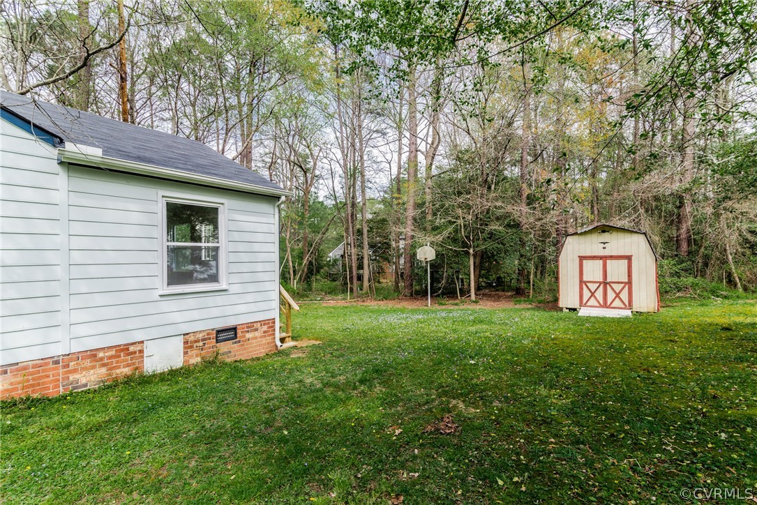4403 Rabbit Foot Place North Chesterfield, VA 23236 - Photo 48 of 50 a front view of a house with a yard and trees