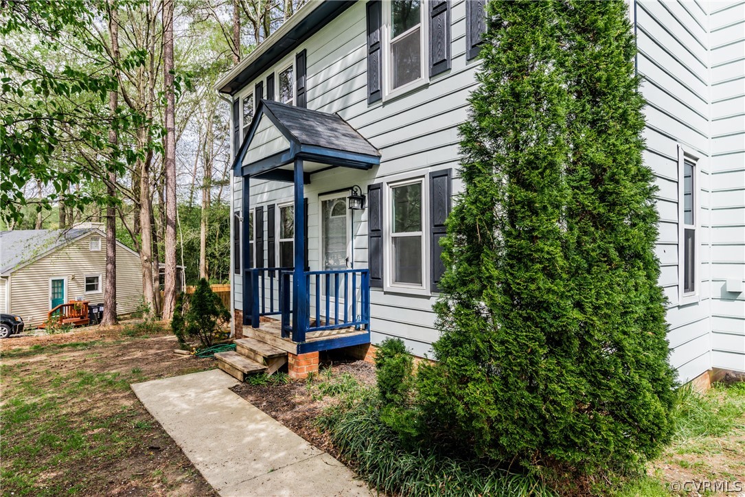 4403 Rabbit Foot Place North Chesterfield, VA 23236 - Photo 5 of 50 a view of a house with a small yard plants and large tree