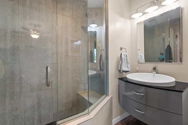 a bathroom with a sink and mirror