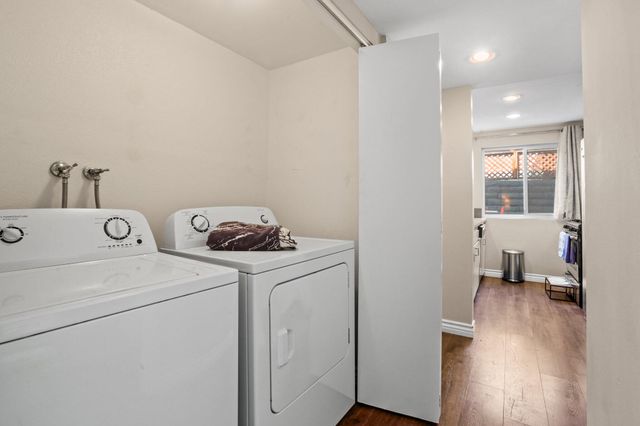 a view of storage and utility room with washer and dryer