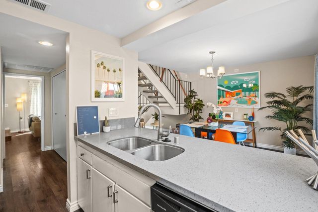 a kitchen with a sink and a refrigerator