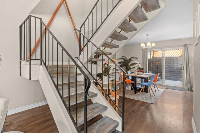 a view of entryway dining room and hall with wooden floor