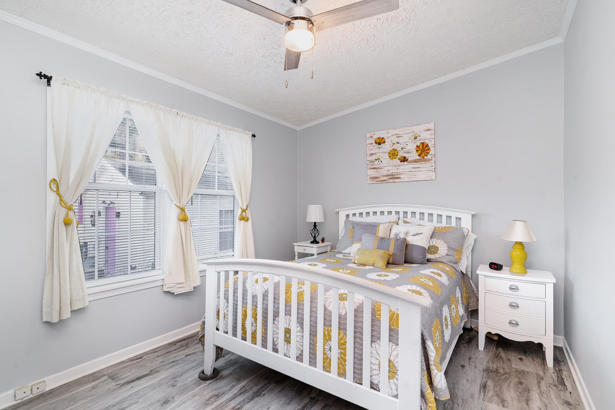 706 Oliver Drive Murrells Inlet, SC 29576 - Photo 16 of 29 Bedroom featuring a textured ceiling, ornamental molding, ceiling fan, and wood finished floors