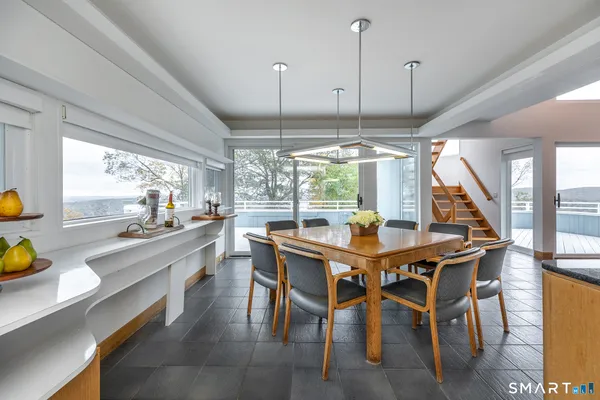 a large white kitchen with a large window