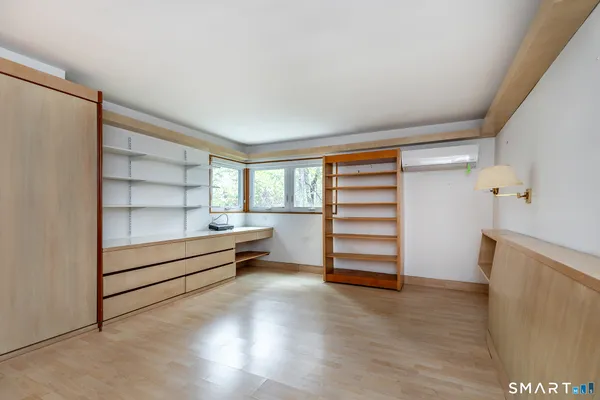 a view of an empty room with a window
