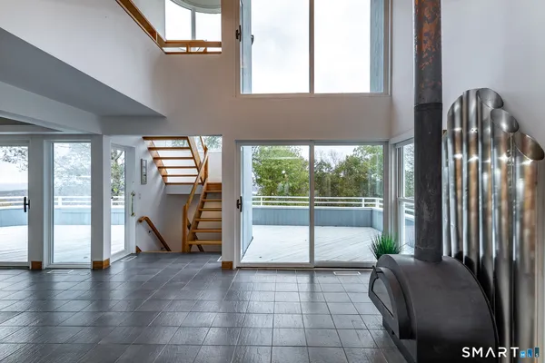 a kitchen with a table chairs and outdoor view