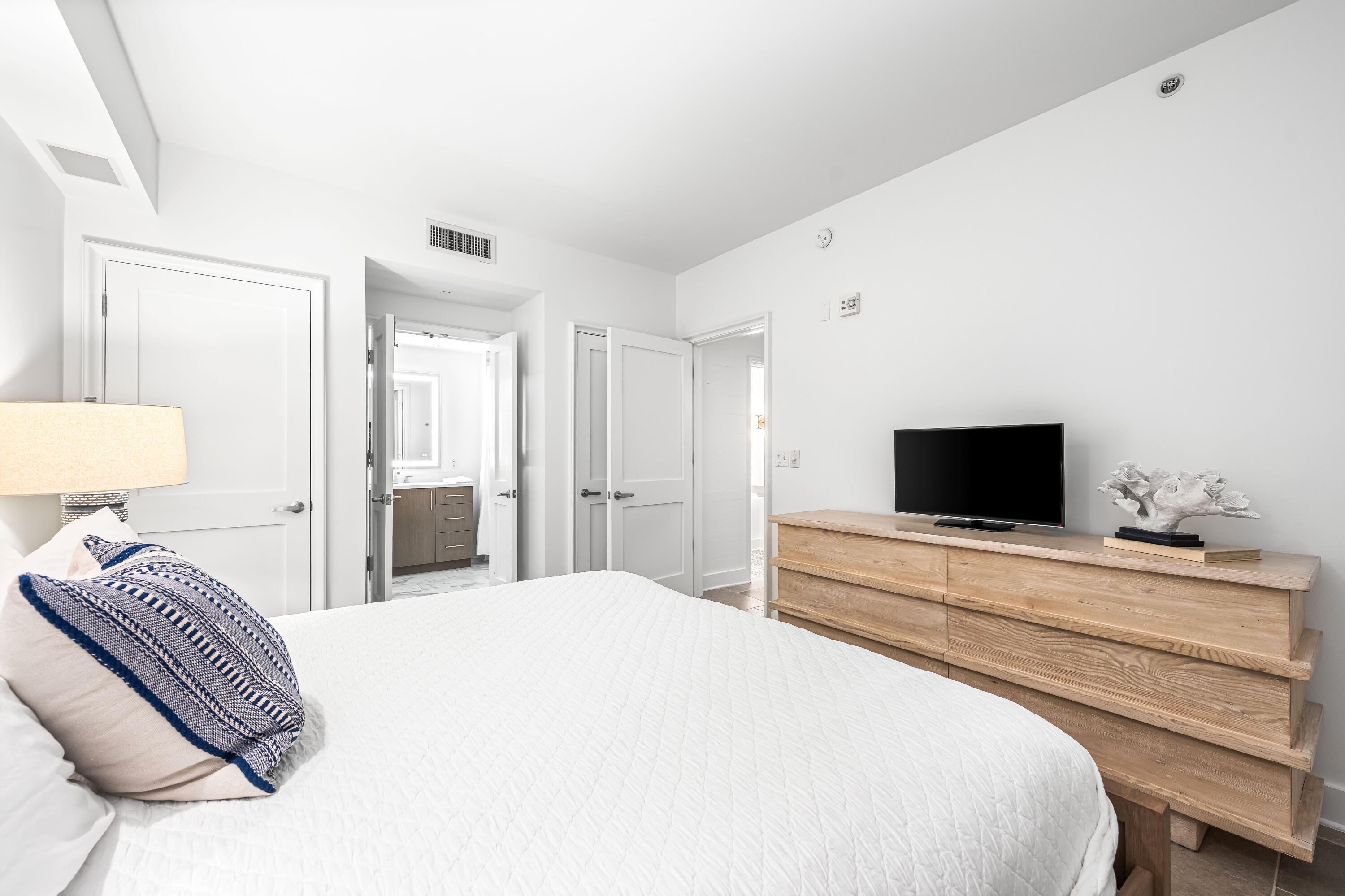 136 Georgetown Avenue, Unit 3B3 Inlet Beach, FL 32461 - Photo 25 of 68 a bedroom with a bed and a flat screen tv