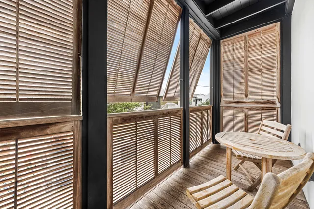 a view of a chairs and table in patio