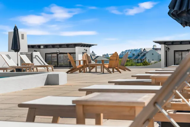 a view of a terrace with furniture and city view