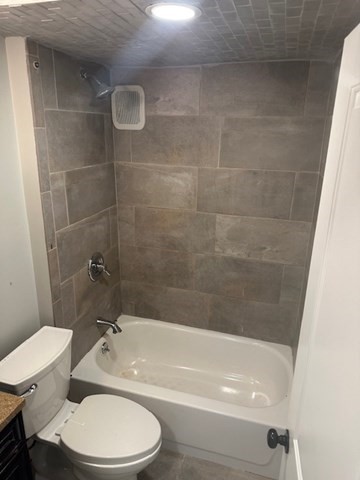 19 Water Street, Unit 1 Milford, MA 01757 - Photo 6 of 15 a white toilet and tub sitting next to a bathroom sink