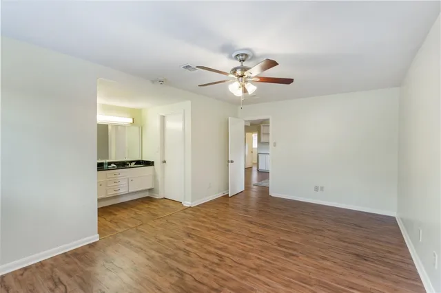 a kitchen with stainless steel appliances kitchen island granite countertop a refrigerator stove and sink