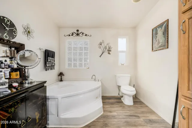 a bathroom with a sink toilet and a mirror
