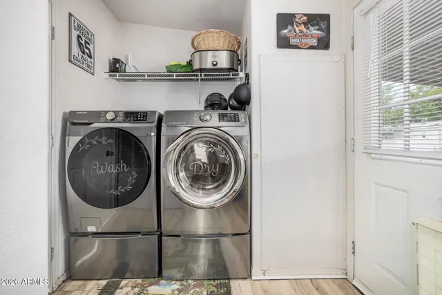 a close view of a utility room with washer and dryer