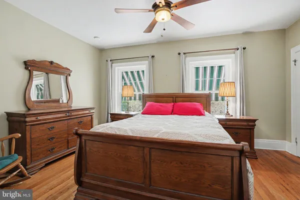 a view of room with furniture and wooden floor