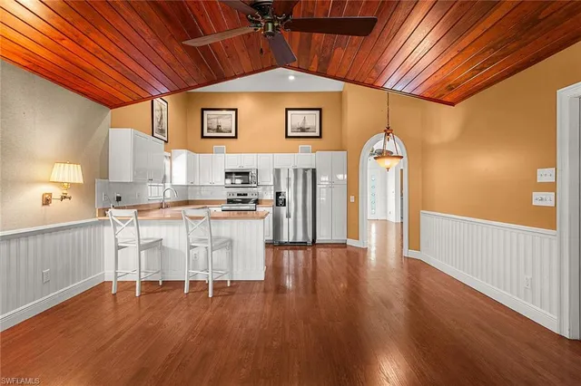 a view of a kitchen with wooden floor