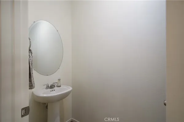 a bathroom with a sink and mirror